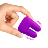 Bang Dual Silicone Clitoral Vibrator Purple held in hand, showcasing its soft silicone design and dual motors.