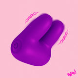Bang Dual Silicone Clitoral Vibrator Purple on a pink background with a power button and vibration lines.