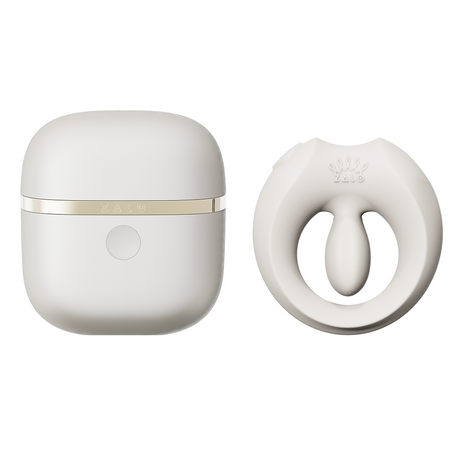ZALO Apis Vibrating Couples Ring Ivory White next to its sleek charging case in elegant design.