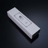 Elegant white packaging box with embossed design and logo, perfect for stylish product presentation.