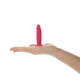 Addiction Silly Willy Glow in the Dark Mini Dongs displayed in a hand, showcasing its playful design and glow-in-the-dark feature.