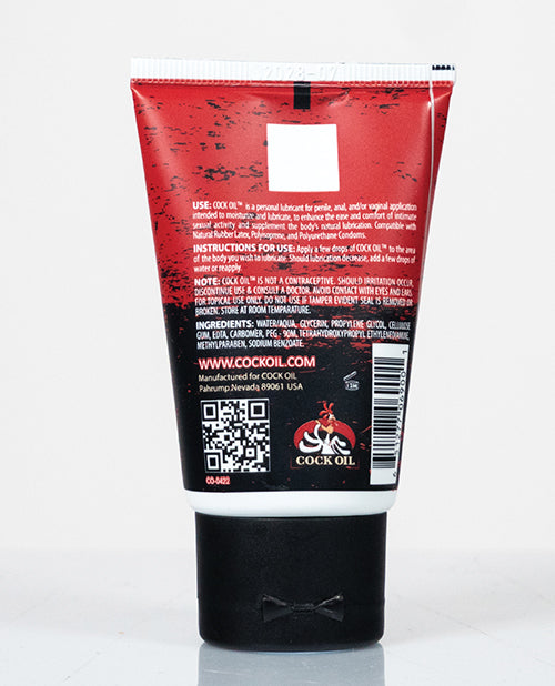 Cock Oil Water-based Lubricant Squeeze Tube 2 Oz with instructions for use on the back.