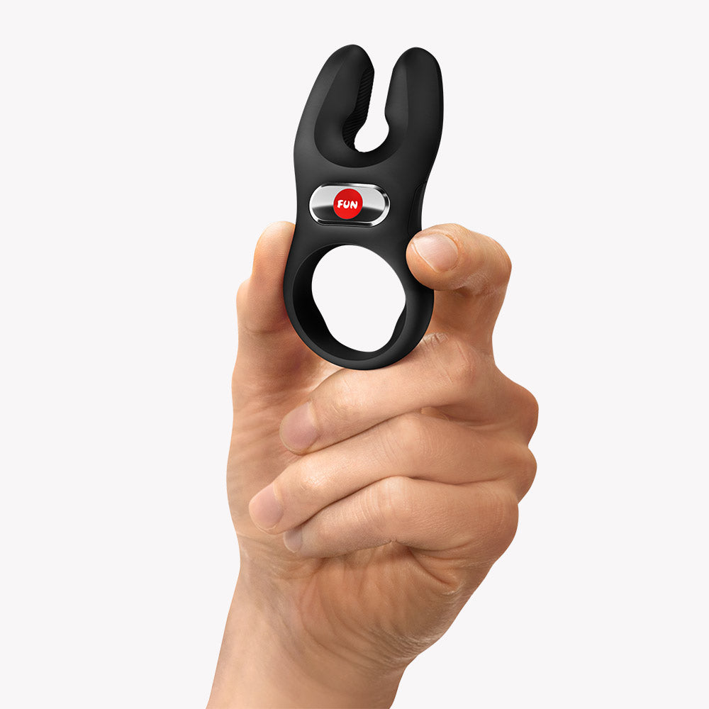 Fun Factory NOS Pro Vibrating Cock Ring Black held in hand highlighting its design and features for enhanced stimulation.