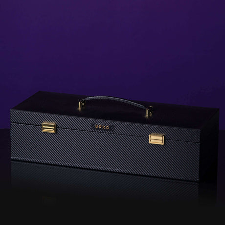Luxurious black Italian leather bondage tools case with gold accents, featuring a sleek design and sturdy handle.