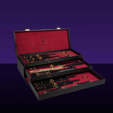 Luxury Italian leather bondage tools set in a stylish case with gold accents and red velvet lining, designed for BDSM play.