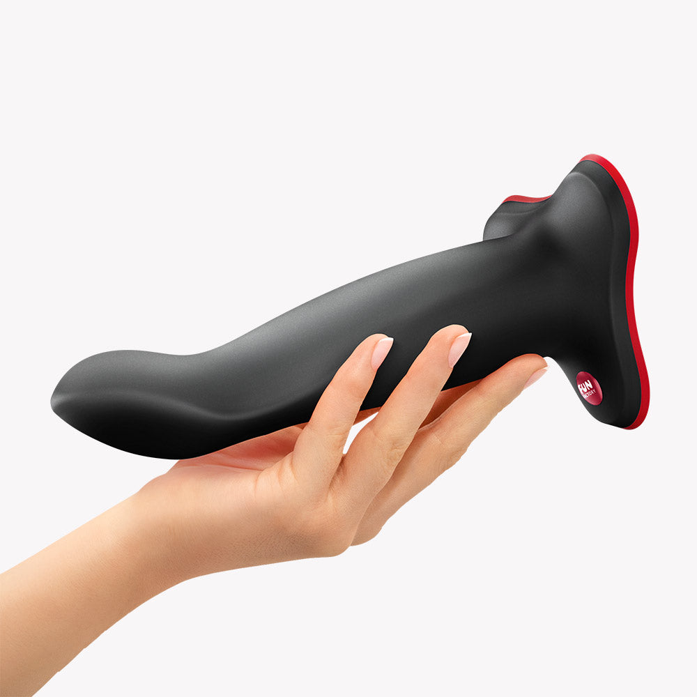Fun Factory Limba Flex L Bendable Dildo Black held in hand showcasing its flexible design and tapered tip.