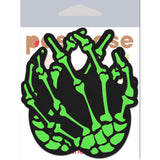 Pastease Neon Green Skeleton Hands Nipple Pasties featuring vivid zombie green bony designs on a black background.