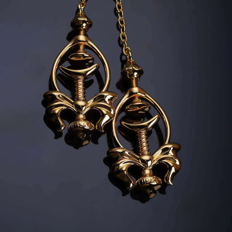 Elegant gold pulling chain nipple clamps with intricate design, showcasing adjustable pain control and comfortable fit.
