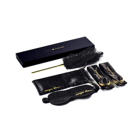 Carpe Diem Premium Silk Bondage Set by UPKO, featuring blindfolds, satin storage bag, and feather tickler in elegant packaging.