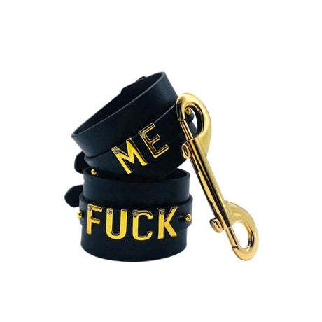 FUCK ME Luxury Italian Leather Handcuffs by UPKO featuring gold lettering and a stylish clasp, designed for sensual elegance.