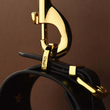 FUCK ME Luxury Italian Leather Handcuffs by UPKO close-up showing gold hardware and quality craftsmanship.