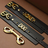 FUCK ME Luxury Italian Leather Handcuffs by UPKO featuring gold lettering and clasps on black leather straps.