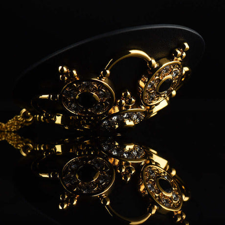 Baroque Leather Nippies by UPKO featuring rhinestones and zircon gems with tassels, elegant black leather, and gold accents.