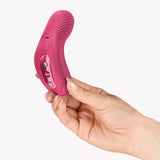 Hand holding the Fun Factory Laya III Lay-on Vibrator Magenta, showcasing its ergonomic design and controls.