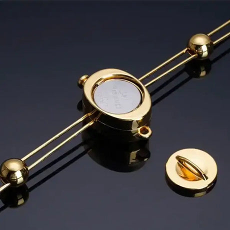 Gold UPKO Double Bar Vibration Nipple Clamp with clitoral chain, showcasing innovative design and metallic finish.