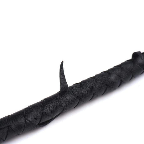 Close-up of ZALO & UPKO Designer Collection Leather Thorn Whip with intricate black leather detail and thorn pattern.