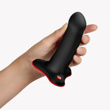 Fun Factory Amor G-Spot Dildo Black held in hand, showcasing its ergonomic design for G-spot pleasure.