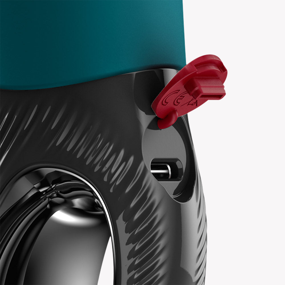 Detail of the Fun Factory Manta Vibrating Masturbator Bottle Green showing charging port and flexible structure.