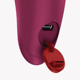 Close-up of the charging port on the Fun Factory Charme Bullet Vibrator Wine Red with a red cap.