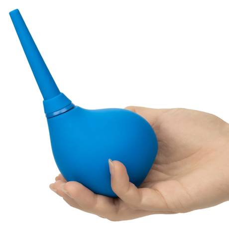 CalExotics One-Way Silicone Anal Douche Blue held in a hand, showcasing its ergonomic design for comfort.